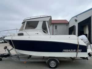 Ambarcatiune Pegazus 550 cabinata; motor honda 150; — miniatura 10