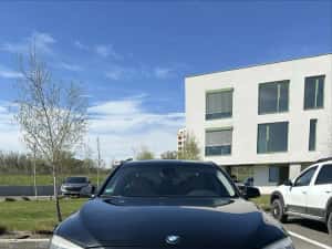 BMW 740 xDrive 2011 — miniatura 1